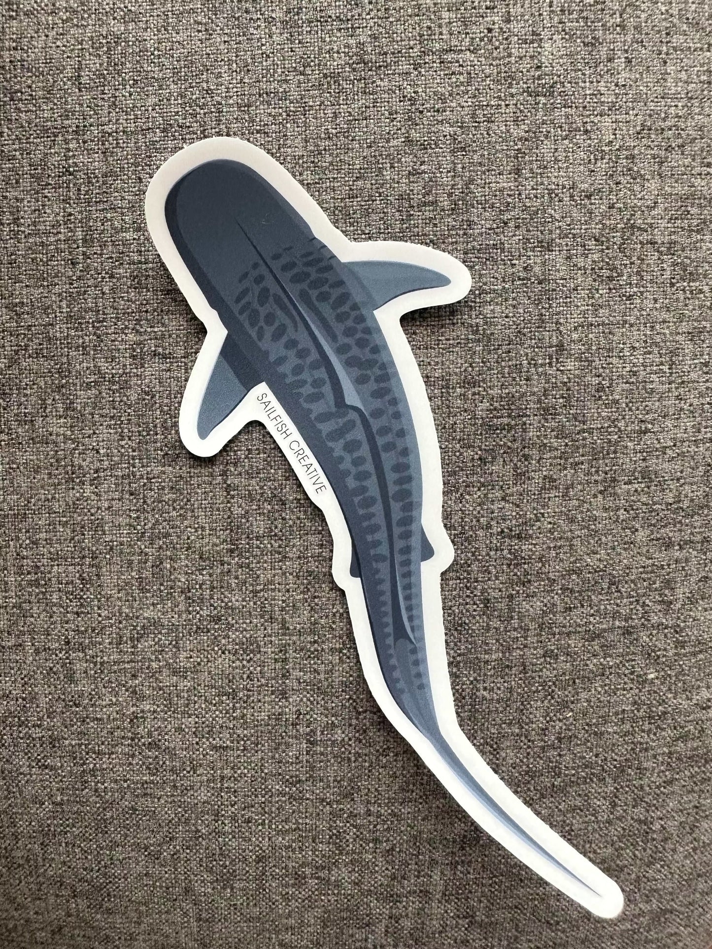 Tiger Shark sticker on gray fabric background, 100mm x 100mm, durable vinyl with matte laminate