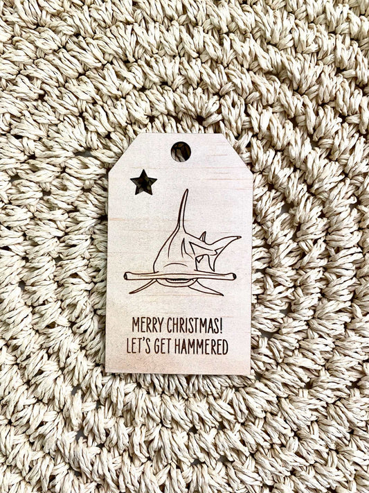 Wooden Christmas swing tag with etched hammerhead shark and Merry Christmas text.