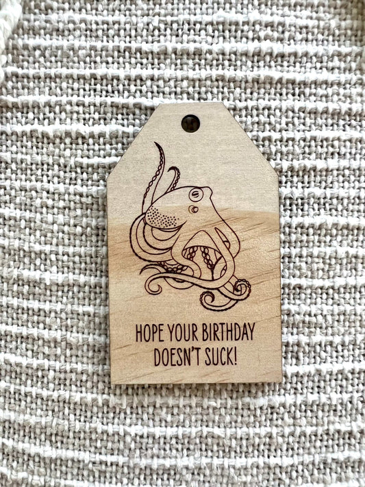 Wooden birthday gift tag with etched octopus design and humorous birthday message