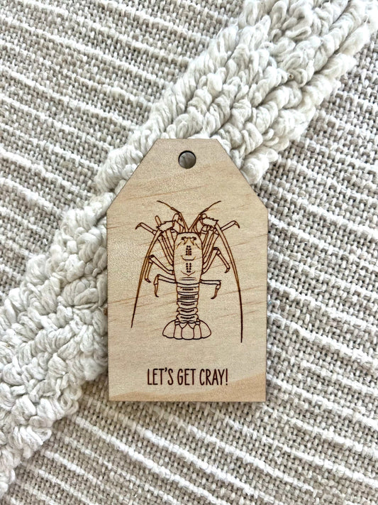 Wooden gift tag with etched rock lobster crayfish design and "Let's Get Cray!" text
