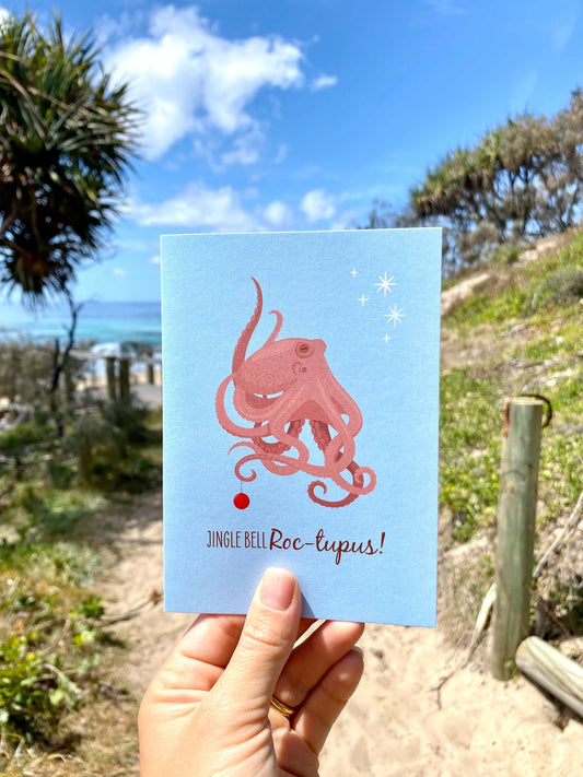 Christmas Card featuring a funny octopus illustration with ocean background and festive text Roc-tupus