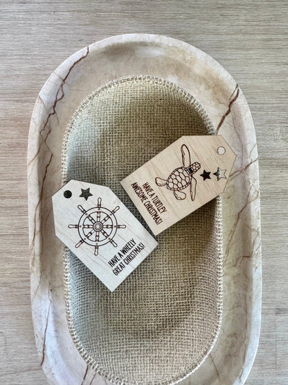 Wooden Christmas swing tag with ships wheel design, etched plywood, ocean-themed gift tag