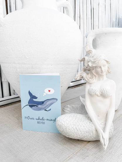 Lovers Card featuring a digital illustration of a humpback whale with "I'm Over-whale-ming Into You" message, eco-friendly recycled card and envelope
